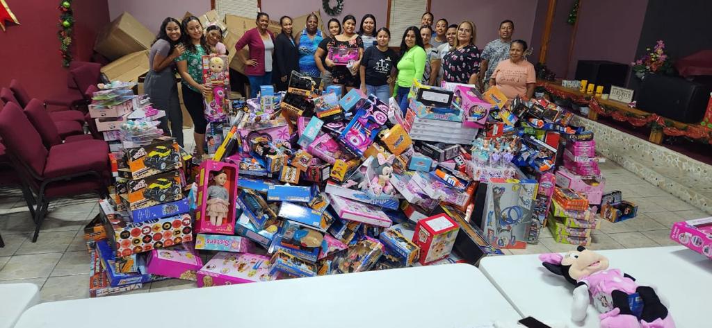 Volunteers prepping toys for the Toy Drive held on December 23, 2022 in San Pedro, Belize