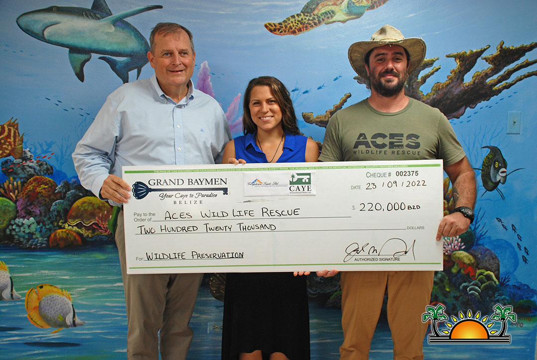 Joel Nagel handing off 100,000 USD donation check to ACES Wildlife Rescue 2022